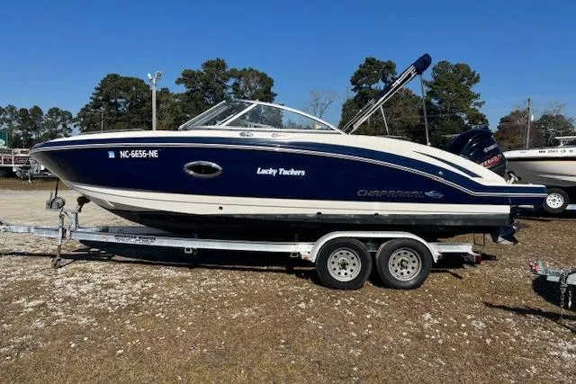 Slide: The Image of 2018 Chaparral 230 Suncoast boat on trailer, side view, outdoors. - 9