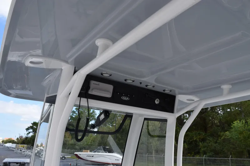Slide: The Image of 2026 Sea Hunt Ultra 255 SE boat console with electronics and canopy. - 10