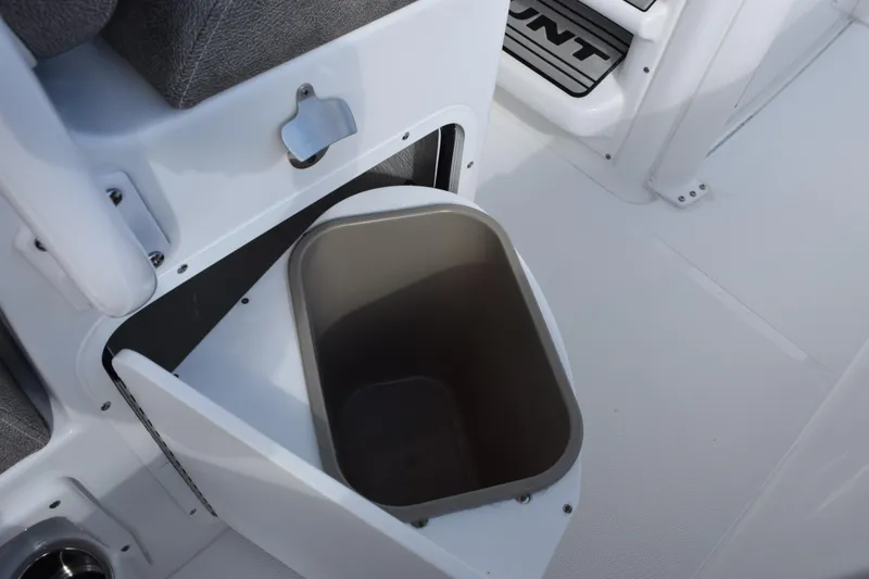 Slide: The Image of 2026 Sea Hunt Ultra 255 SE boat interior with built-in storage compartment. - 19