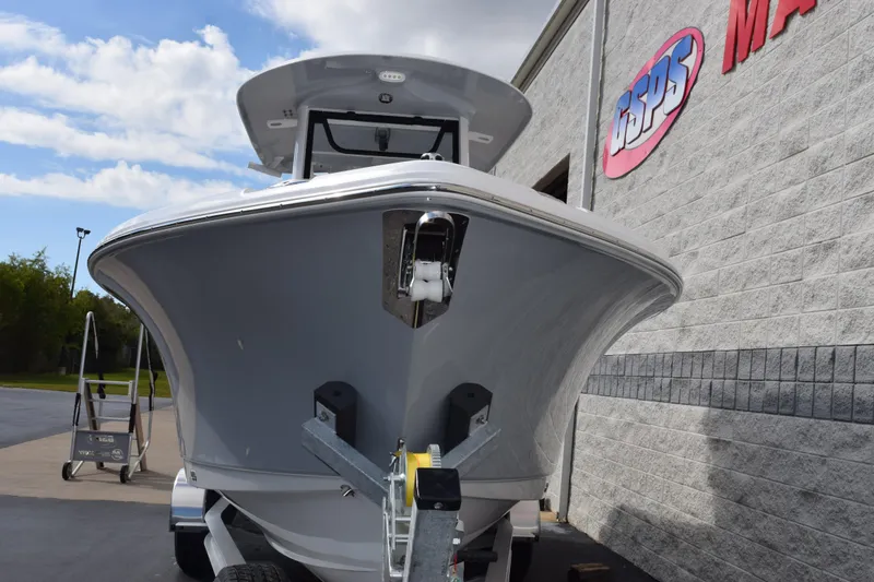 Slide: The Image of 2026 Sea Hunt Ultra 255 SE boat on trailer, parked outside dealership. - 3