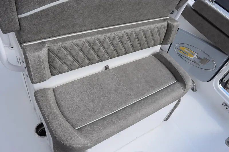 Slide: The Image of Gray seating on 2026 Sea Hunt Ultra 255 SE boat, featuring diamond stitching and sleek design. - 8