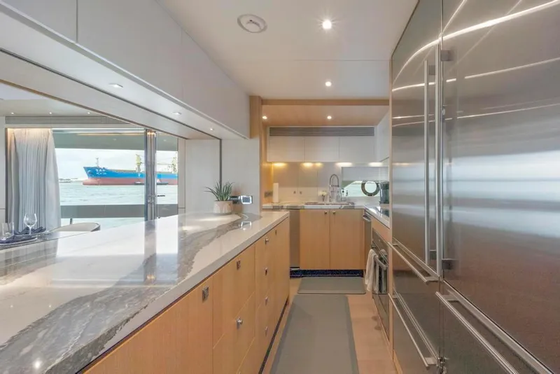 Slide: The Image of Galley w/Marble Counters and Stainless Fridge - 28