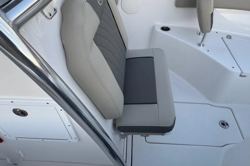 Slide: The Image of 2026 Key West 244 Center Console boat seat with gray and beige upholstery. - 12