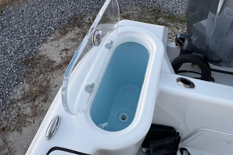 Slide: The Image of Open livewell on 2026 Key West 244 Center Console boat, showing interior details. - 20