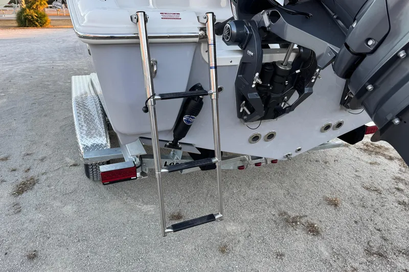 Slide: The Image of Rear view of 2026 Key West 244 Center Console boat with ladder and trailer. - 6