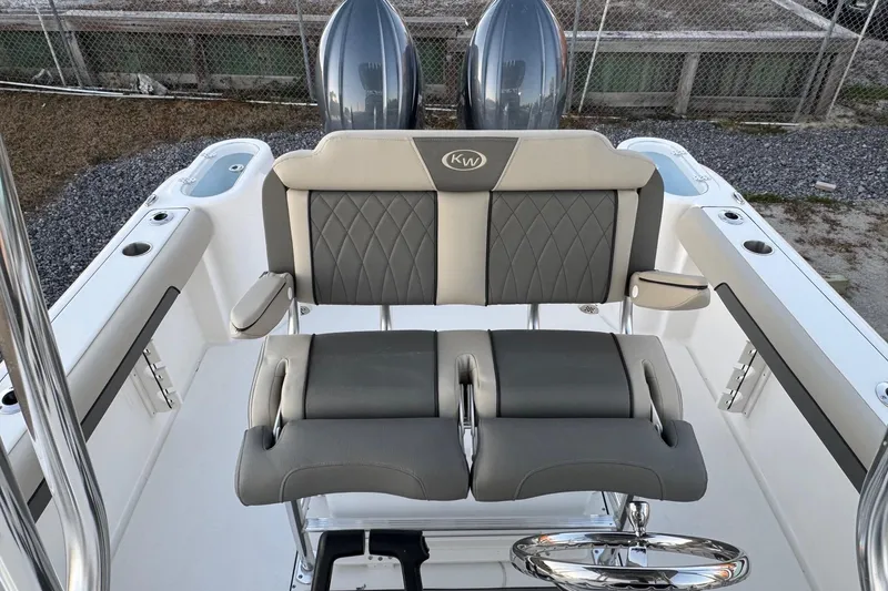 Slide: The Image of 2026 Key West 244 Center Console boat with dual engines and cushioned seating. - 14