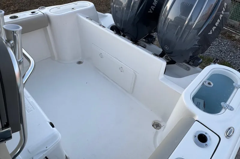 Slide: The Image of 2026 Key West 244 Center Console boat interior with dual Yamaha engines. - 19