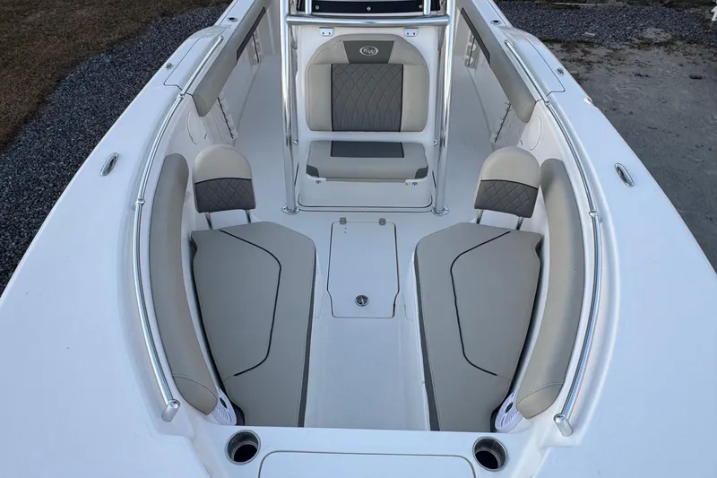 Slide: The Image of 2026 Key West 244 Center Console boat interior with cushioned seating and sleek design. - 8