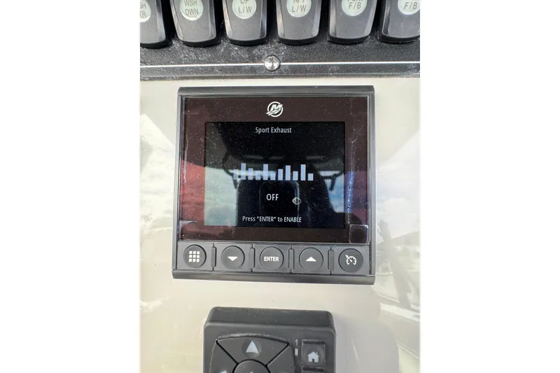 Slide: The Image of Control panel of 2024 Boston Whaler 280 Outrage with sport exhaust settings. - 21