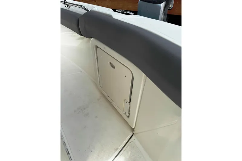 Slide: The Image of 2024 Boston Whaler 280 Outrage interior storage compartment detail. - 28
