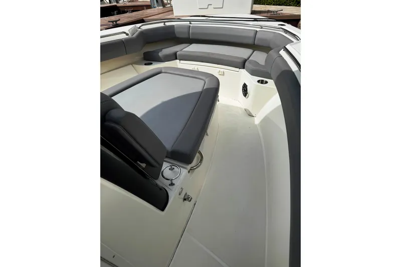 Slide: The Image of 2024 Boston Whaler 280 Outrage interior with cushioned seating and cup holders. - 7