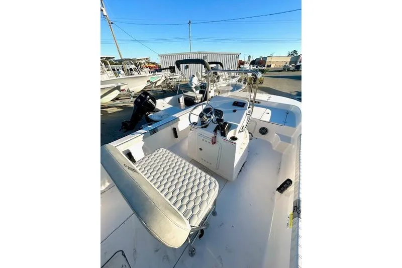 Slide: The Image of 2025 Carolina Skiff 19 LS boat interior with steering console and seating. - 7