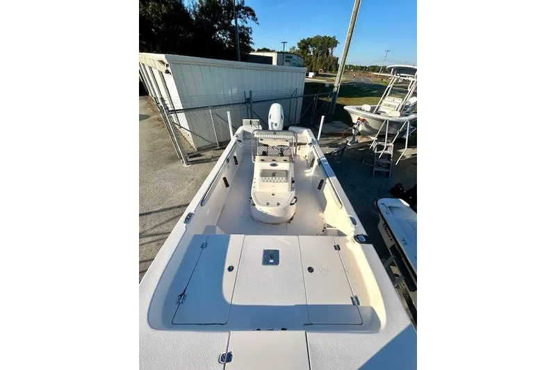 Slide: The Image of 2025 Carolina Skiff 19 LS boat, spacious deck, outdoor setting. - 8