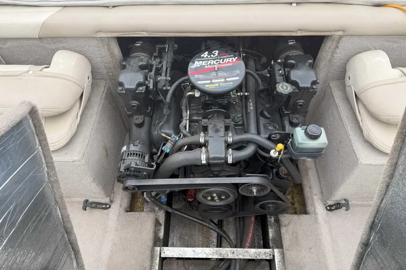 Slide: The Image of 2003 Alumacraft boat engine, featuring a 4.3L MerCruiser motor, in a beige interior setting. - 7