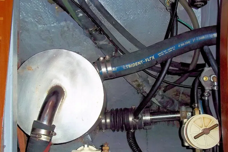 Slide: The Image of Engine compartment of 1984 Slocum 43 sailboat with Trident-Flex marine exhaust hose. - 15
