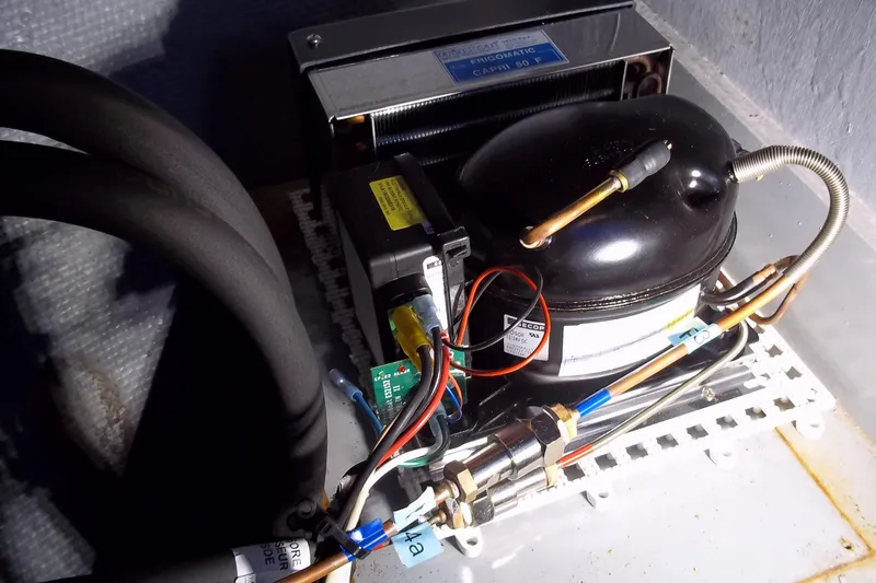 Slide: The Image of 1984 Slocum 43 refrigeration unit with wiring and components. - 17