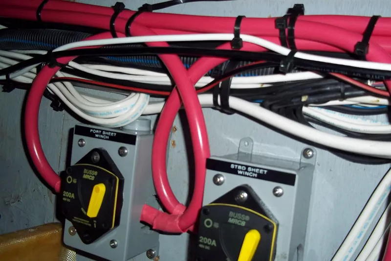 Slide: The Image of Electrical wiring and switches on a 1984 Slocum 43 boat. - 21