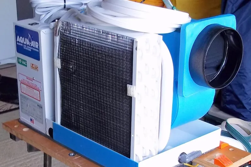Slide: The Image of Marine air conditioning unit on a Slocum 43, 1984 model, with visible wiring and components. - 23