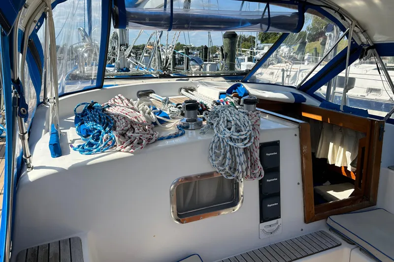 Slide: The Image of Cockpit of 1984 Slocum 43 sailboat with ropes and navigation equipment. - 5
