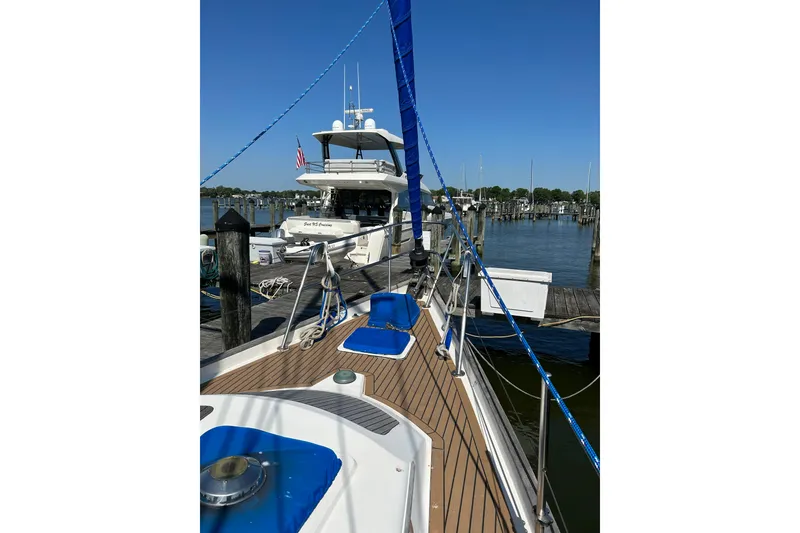 Slide: The Image of Sailboat docked at marina, Slocum 43, 1984 model, sunny day, clear blue sky. - 8
