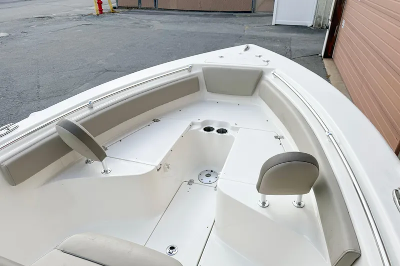 Slide: The Image of 2022 Key West 239 FS boat interior with seating and cup holders. - 3