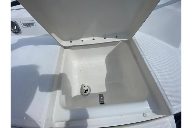 Slide: The Image of Open storage compartment on 2010 Sea Ray 300 SLX boat deck. - 5