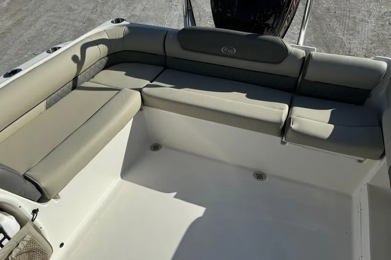 Slide: The Image of 2025 Key West 239 DFS boat interior with cushioned seating and sleek design. - 19