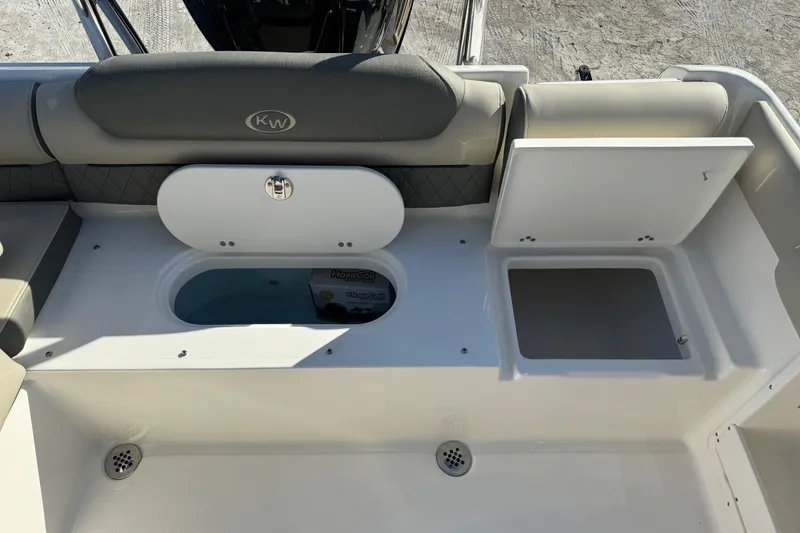 Slide: The Image of 2025 Key West 239 DFS boat interior with storage compartments and seating. - 20