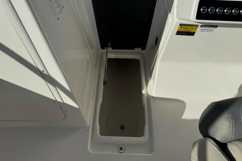 Slide: The Image of 2025 Key West 239 DFS boat interior storage compartment, white finish. - 21