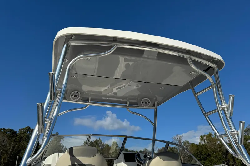 Slide: The Image of 2025 Key West 239 DFS boat with sleek T-top under clear blue sky. - 5