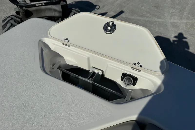 Slide: The Image of Open storage compartment on 2025 Key West 239 DFS boat deck. - 9