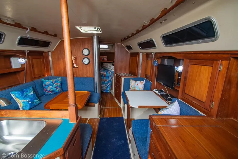 Slide: The Image of Interior of 1984 Catalina 36 sailboat with wood finish and blue upholstery. - 11