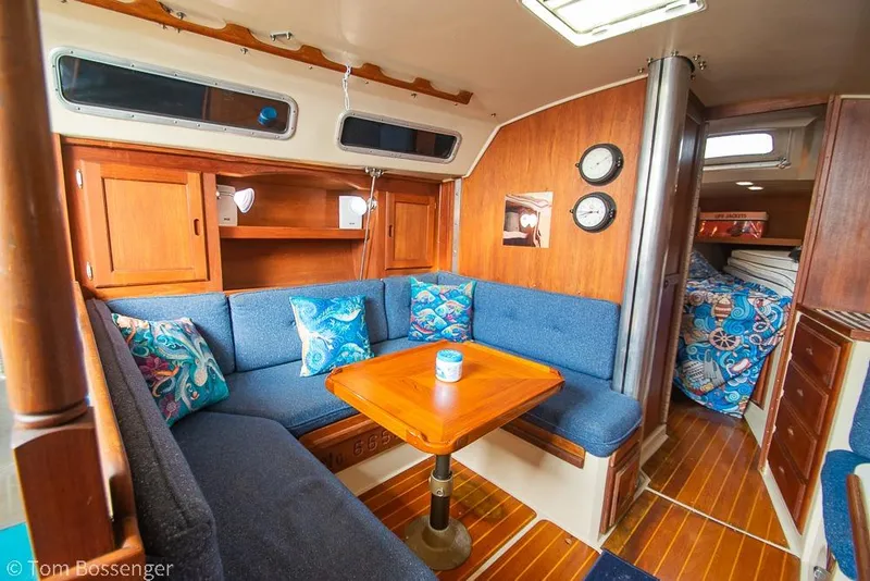 Slide: The Image of Interior of 1984 Catalina 36 sailboat with cozy seating and nautical decor. - 12