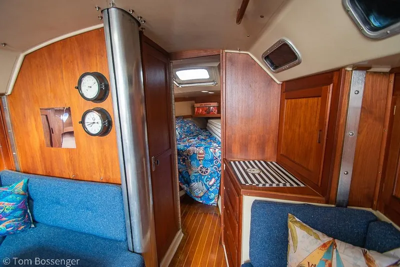 Slide: The Image of Interior of 1984 Catalina 36 sailboat with wood paneling and cozy cabin. - 16