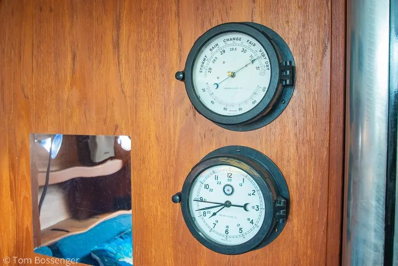 Slide: The Image of Barometer and clock on 1984 Catalina 36 yacht's wooden interior panel. - 17
