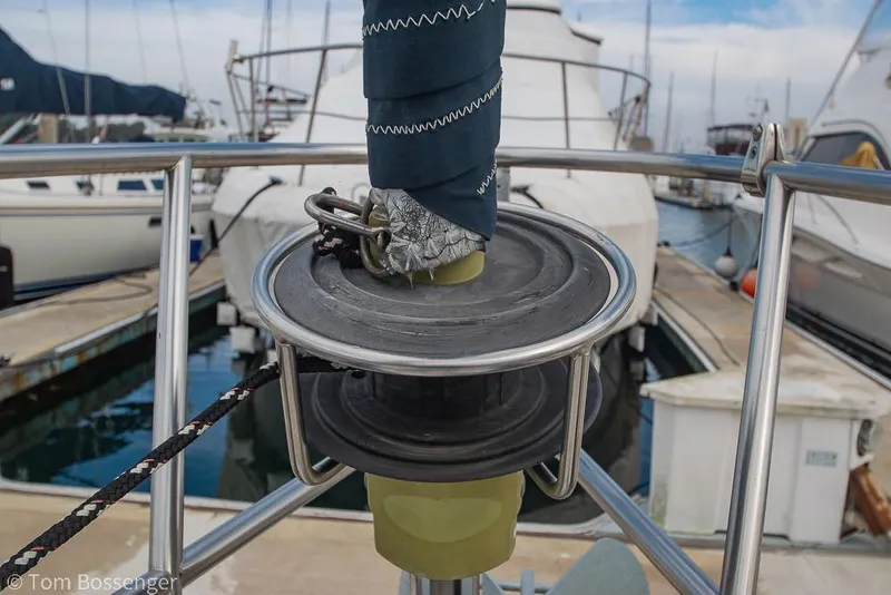 Slide: The Image of Close-up of a 1984 Catalina 36 sailboat's furling system at a marina. - 34