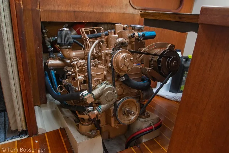 Slide: The Image of Engine of a 1984 Catalina 36 sailboat, detailed view in wooden compartment. - 38