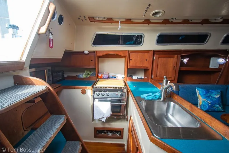 Slide: The Image of Interior of a 1984 Catalina 36 sailboat kitchen with stove and sink. - 7