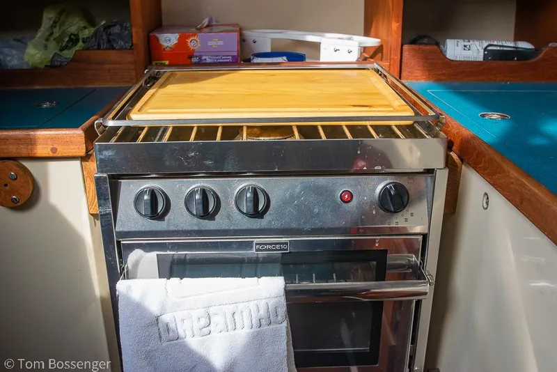 Slide: The Image of Stove and oven in 1984 Catalina 36 yacht kitchen with wooden countertops. - 9