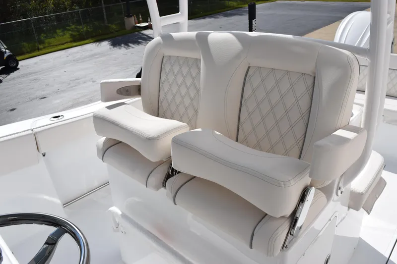 Slide: The Image of Luxurious seating on 2026 Sea Hunt Ultra 305 Coffin Box boat, featuring diamond-stitched upholstery. - 12