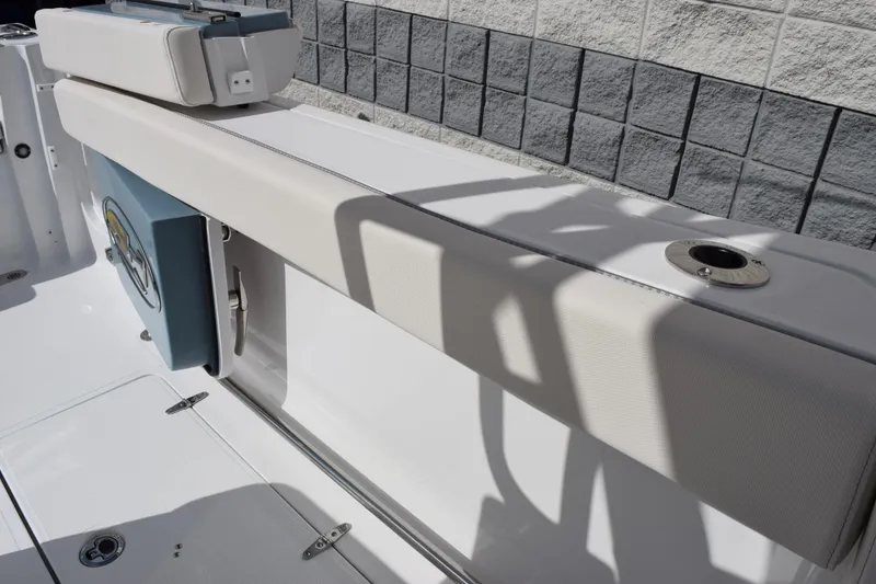 Slide: The Image of 2026 Sea Hunt Ultra 305 Coffin Box boat interior with cushioned seating and storage. - 16