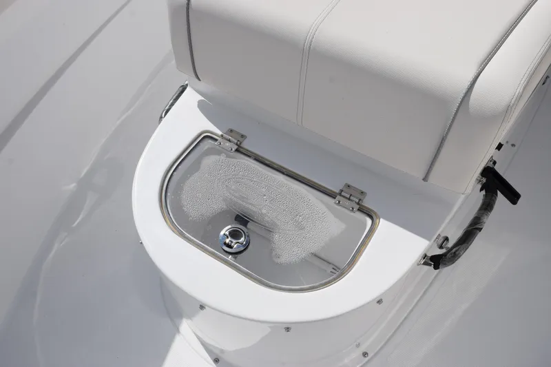 Slide: The Image of Sea Hunt Ultra 305 Coffin Box 2026, featuring a sleek white seat and storage compartment. - 19