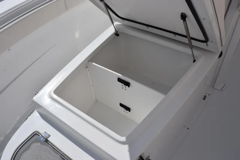 Slide: The Image of Open storage compartment on 2026 Sea Hunt Ultra 305 Coffin Box boat. - 20