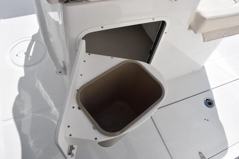Slide: The Image of Trash compartment on 2026 Sea Hunt Ultra 305 Coffin Box boat deck. - 21