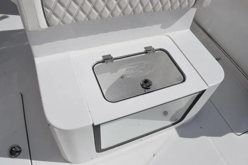 Slide: The Image of Sea Hunt Ultra 305 Coffin Box 2026, featuring a sleek white design and cushioned seating. - 23