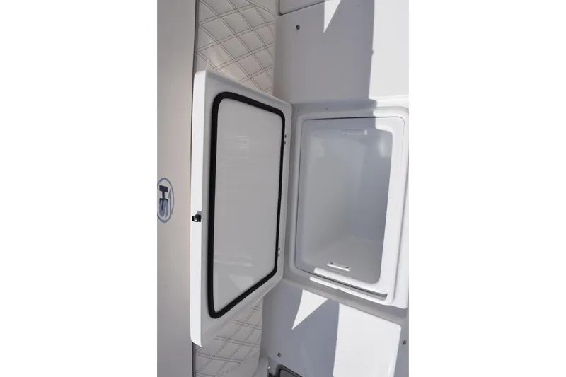 Slide: The Image of 2026 Sea Hunt Ultra 305 Coffin Box open storage compartment. - 25