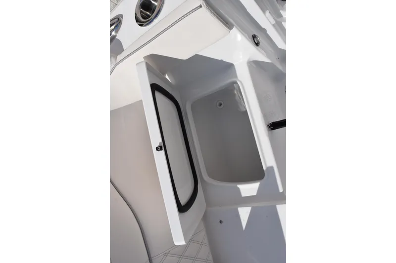 Slide: The Image of 2026 Sea Hunt Ultra 305 Coffin Box open storage compartment. - 26