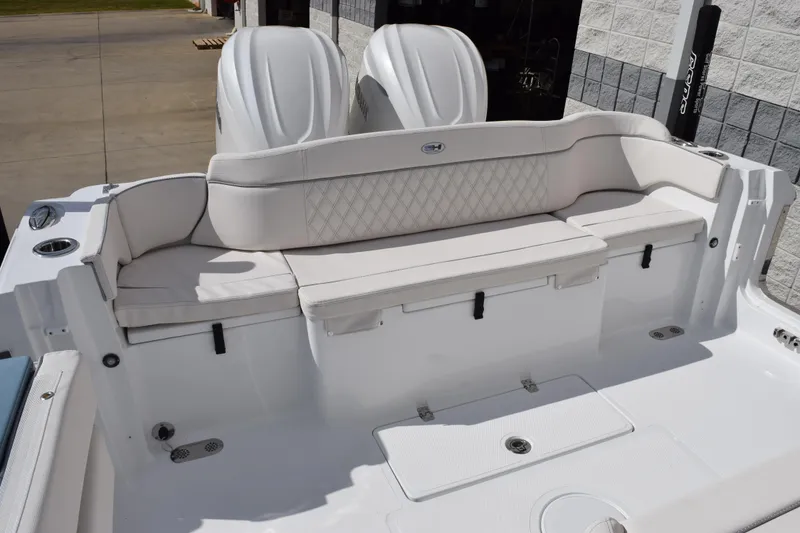 Slide: The Image of 2026 Sea Hunt Ultra 305 Coffin Box boat with white cushioned seating. - 7