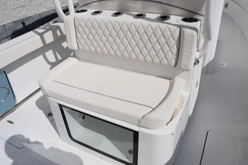 Slide: The Image of 2026 Sea Hunt Ultra 305 Coffin Box boat seating with quilted upholstery and storage. - 8