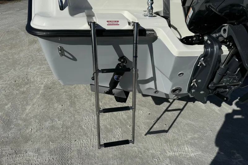 Slide: The Image of 2025 Key West 239 DFS boat with a stainless steel swim ladder. - 6